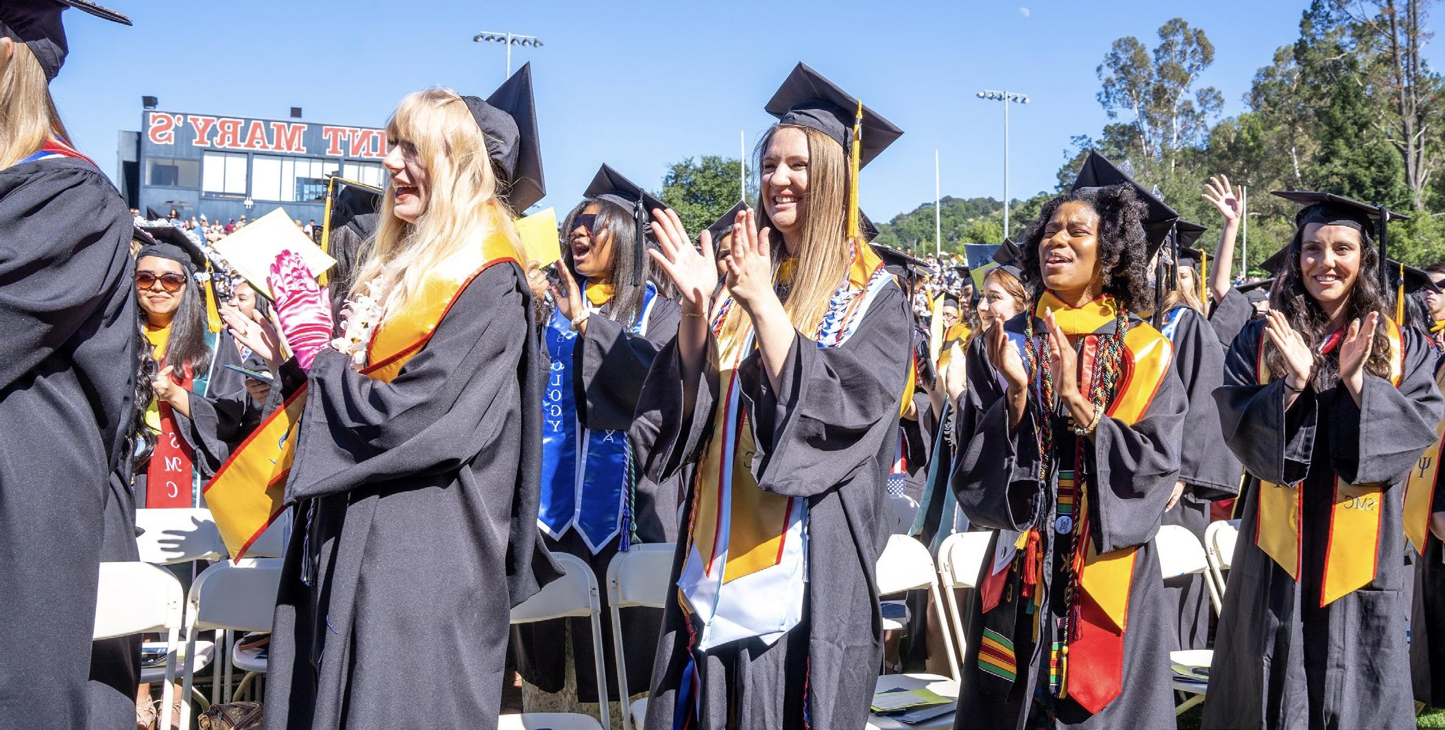 Students at graduation clapping